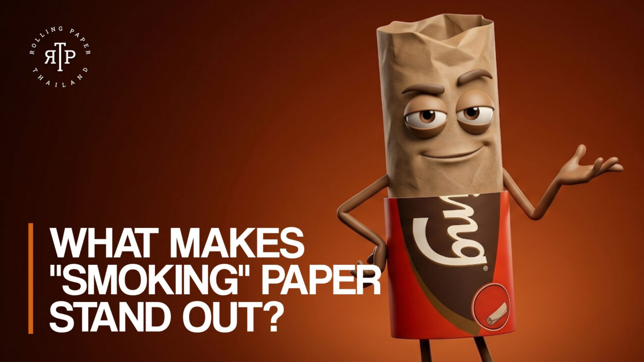 A promotional graphic for Rolling Paper Thailand set against a warm, reddish-brown gradient background. On the right, a 3D animated character resembling a rolled joint stands confidently. The character has a laid-back expression with half-closed eyes and a slight smirk, and it is wearing a red wrapper that mimics the classic "Smoking" brand rolling paper packaging. The character has one hand on its hip and the other gesturing outward. On the bottom left, bold white text reads "WHAT MAKES "SMOKING" PAPER STAND OUT?" next to an orange vertical accent line. The Rolling Paper Thailand (RPT) circular logo is positioned in the top left corner.