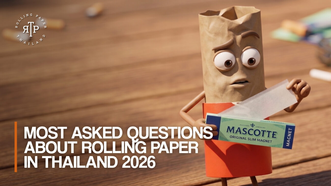 A confused 3D cartoon rolling paper character holding a booklet of Mascotte Original Slim Magnet papers. Large white text overlaid on the image reads "Most Asked Questions About Rolling Paper in Thailand 2026." The Rolling Paper Thailand logo is in the top left corner against a blurred wooden background.